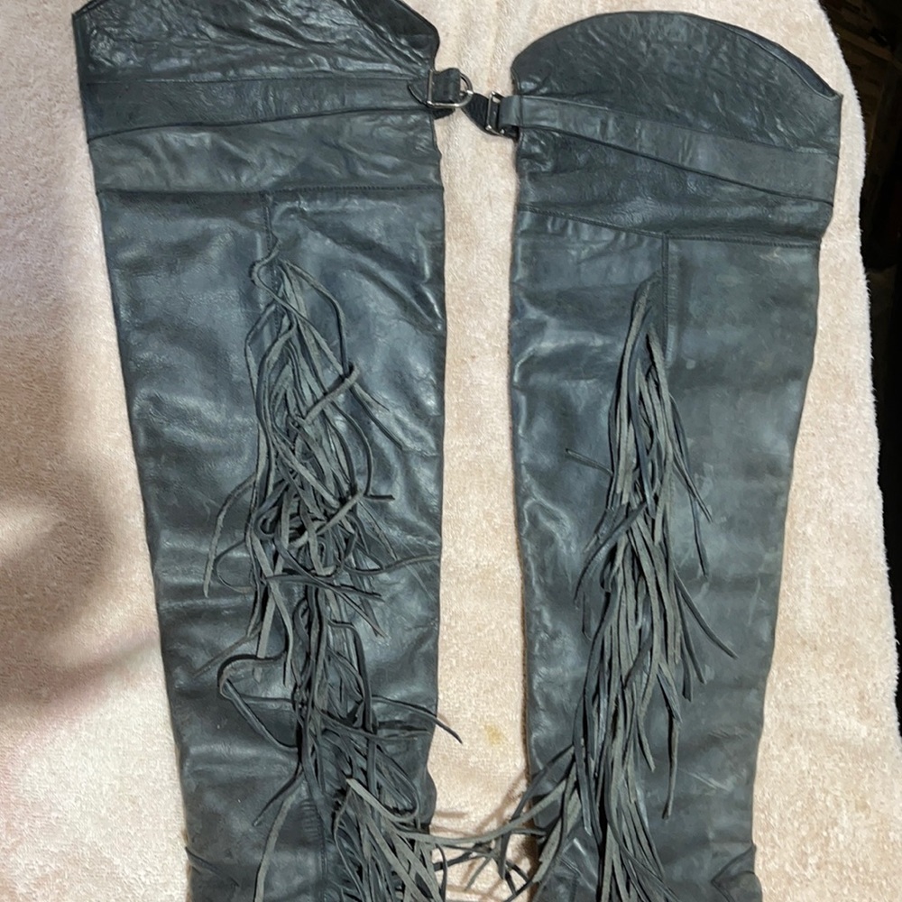 Over the knee fringe leather boots.